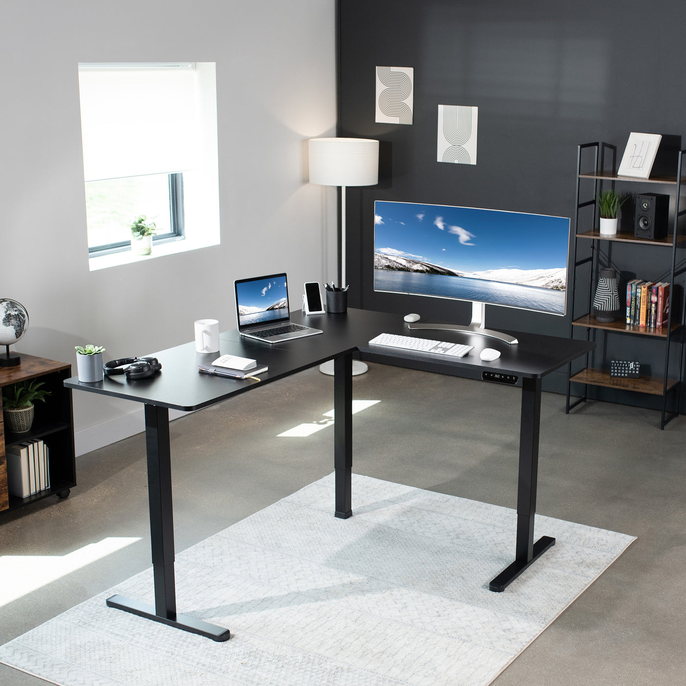 Large heavy-duty electric workstation desk centered in a room. 