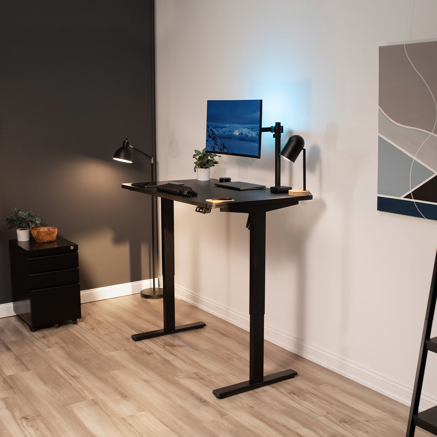 Adjustable standing workstation desk for a modern office workspace.
