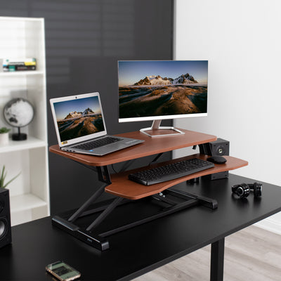 Heavy-duty height adjustable desk riser platform with 2 tiers.